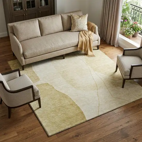 Gold And Beige Abstract Washable Area Rug With UV Protection Photo 1