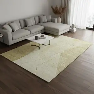 Photo of Gold And Beige Abstract Washable Area Rug With UV Protection