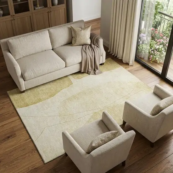 Gold And Beige Abstract Washable Area Rug With UV Protection Photo 1