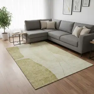 Photo of Gold And Beige Abstract Washable Area Rug With UV Protection
