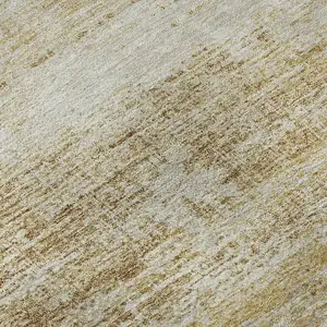 Photo of Gold And Beige Abstract Washable Area Rug With UV Protection