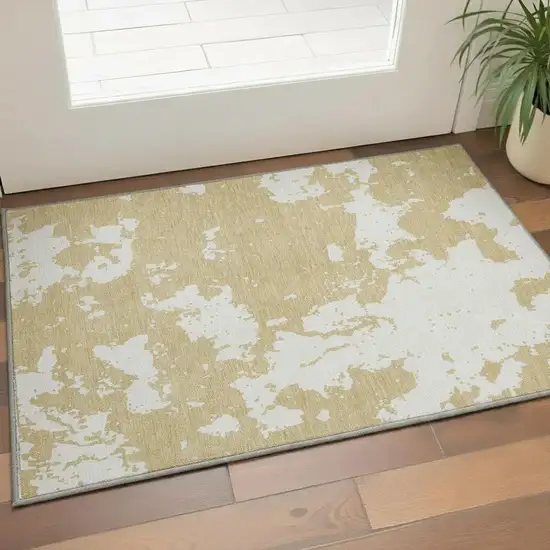 Gold And Beige Abstract Washable Area Rug With UV Protection Photo 2