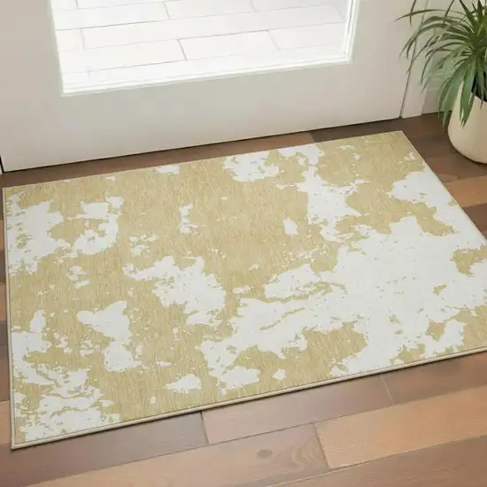 Gold And Beige Abstract Washable Area Rug With UV Protection Photo 1