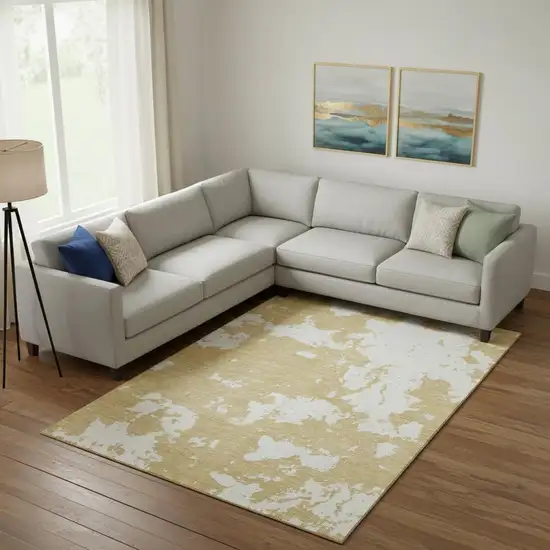 Gold And Beige Abstract Washable Area Rug With UV Protection Photo 1