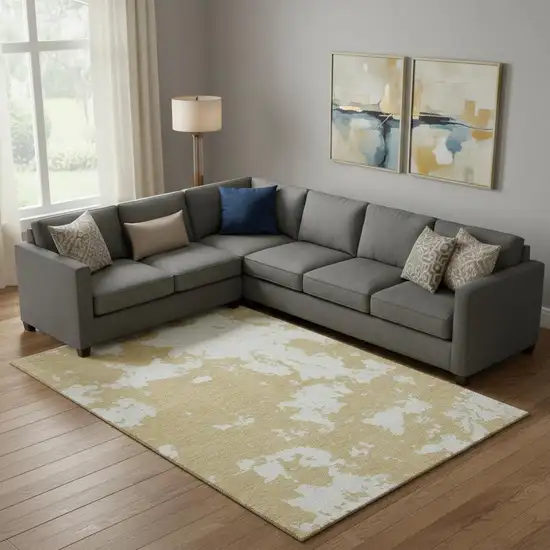 Gold And Beige Abstract Washable Area Rug With UV Protection Photo 1