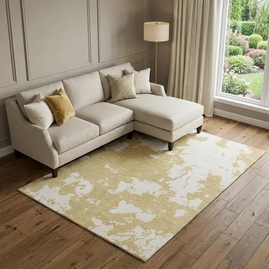 Gold And Beige Abstract Washable Area Rug With UV Protection Photo 1