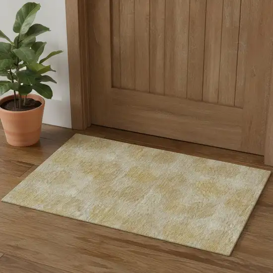 Gold And Beige Abstract Washable Area Rug With UV Protection Photo 1