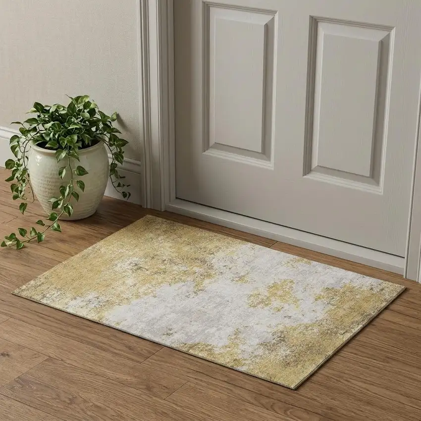 Gold And Beige Abstract Washable Area Rug With UV Protection Photo 1
