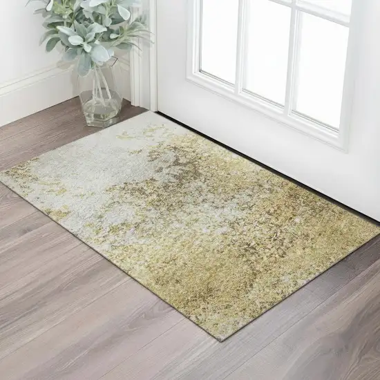 Gold And Beige Abstract Washable Area Rug With UV Protection Photo 2