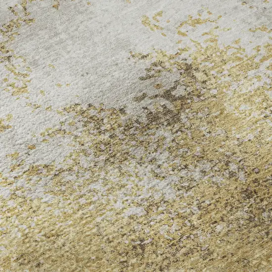 Gold And Beige Abstract Washable Area Rug With UV Protection Photo 1