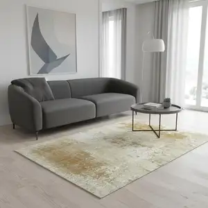 Photo of Gold And Beige Abstract Washable Area Rug With UV Protection