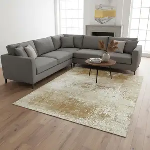 Photo of Gold And Beige Abstract Washable Area Rug With UV Protection