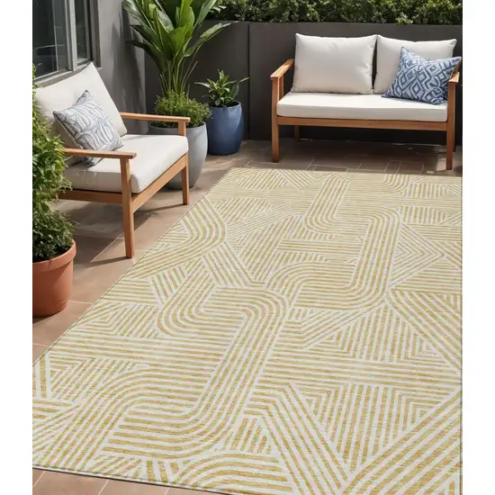 Gold And Beige Abstract Washable Indoor Outdoor Area Rug Photo 1