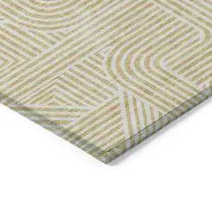 Photo of Gold And Beige Abstract Washable Indoor Outdoor Area Rug