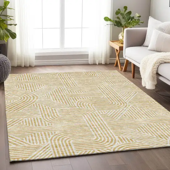 Gold And Beige Abstract Washable Indoor Outdoor Area Rug Photo 9