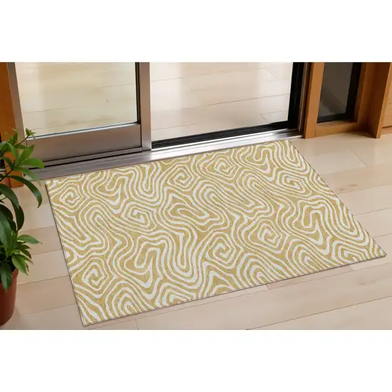 Gold And Beige Abstract Washable Indoor Outdoor Area Rug Photo 1