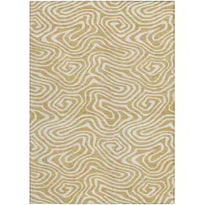 Photo of Gold And Beige Abstract Washable Indoor Outdoor Area Rug