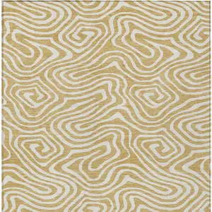 Photo of Gold And Beige Abstract Washable Indoor Outdoor Area Rug