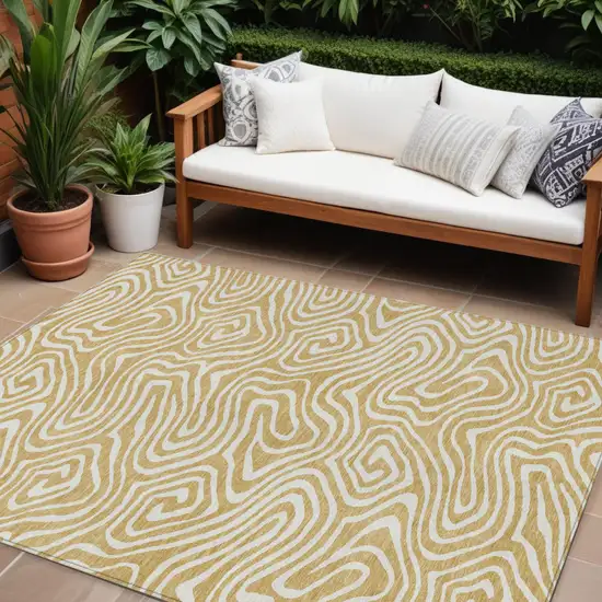 Gold And Beige Abstract Washable Indoor Outdoor Area Rug Photo 1