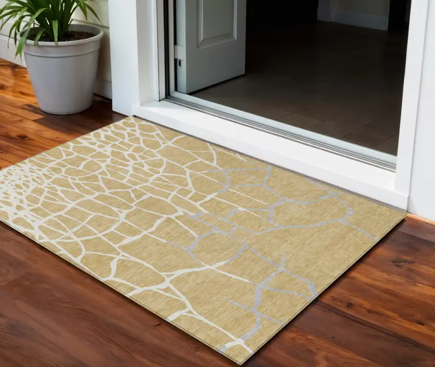 Gold And Beige Abstract Washable Indoor Outdoor Area Rug Photo 1