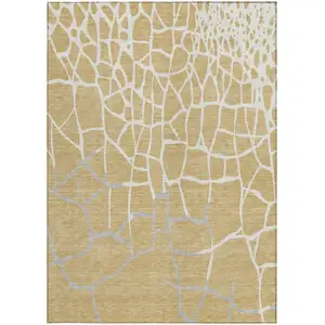 Photo of Gold And Beige Abstract Washable Indoor Outdoor Area Rug