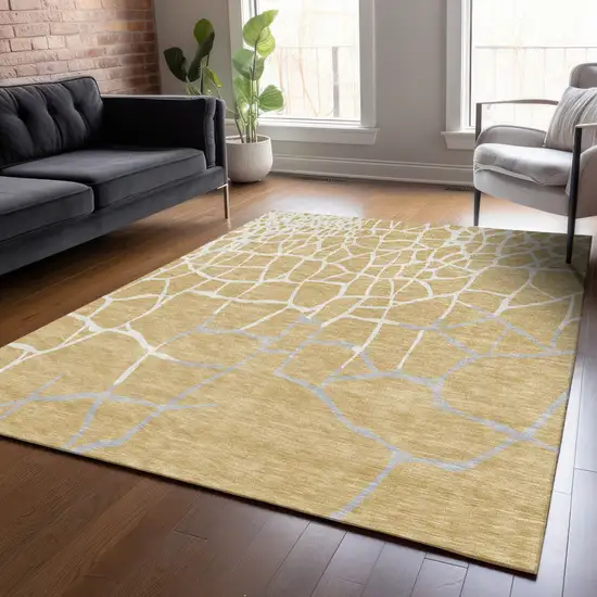 Gold And Beige Abstract Washable Indoor Outdoor Area Rug Photo 8