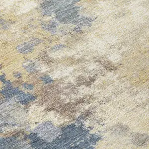 Photo of Gold And Beige Abstract Washable Indoor Outdoor Area Rug