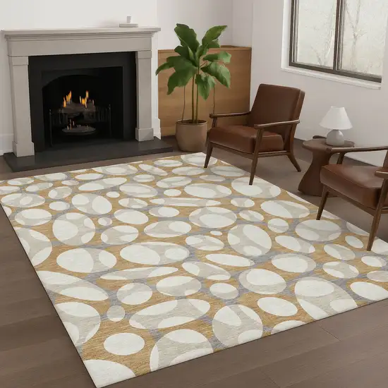 Gold And Beige Abstract Washable Indoor Outdoor Area Rug Photo 6