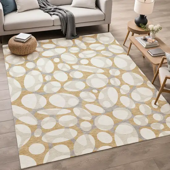 Gold And Beige Abstract Washable Indoor Outdoor Area Rug Photo 5