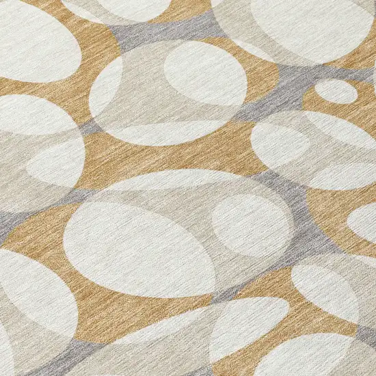 Gold And Beige Abstract Washable Indoor Outdoor Area Rug Photo 9