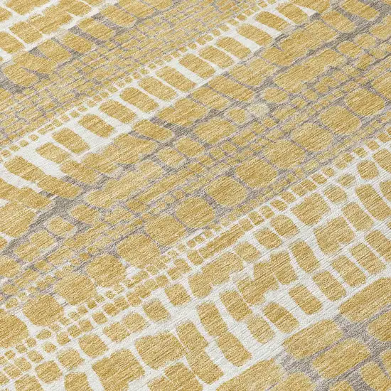 Gold And Beige Abstract Washable Indoor Outdoor Area Rug Photo 9
