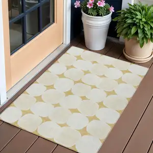 Photo of Gold And Beige Abstract Washable Indoor Outdoor Area Rug