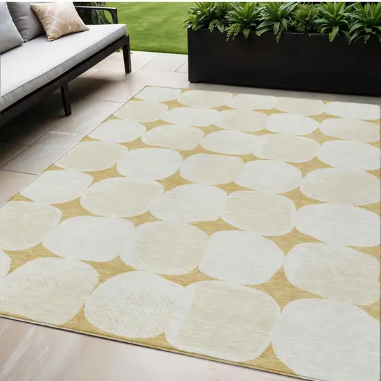 Gold And Beige Abstract Washable Indoor Outdoor Area Rug Photo 1