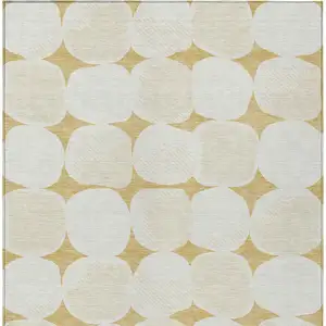 Photo of Gold And Beige Abstract Washable Indoor Outdoor Area Rug