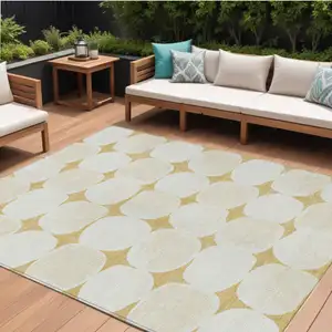 Photo of Gold And Beige Abstract Washable Indoor Outdoor Area Rug