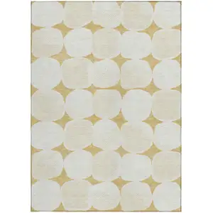 Photo of Gold And Beige Abstract Washable Indoor Outdoor Area Rug