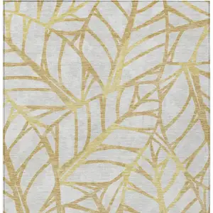 Photo of Gold And Beige Floral Washable Indoor Outdoor Area Rug