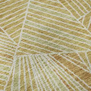 Photo of Gold And Beige Geometric Washable Area Rug With UV Protection