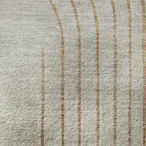 Photo of Gold And Beige Geometric Washable Area Rug With UV Protection