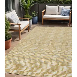 Photo of Gold And Beige Geometric Washable Indoor Outdoor Area Rug