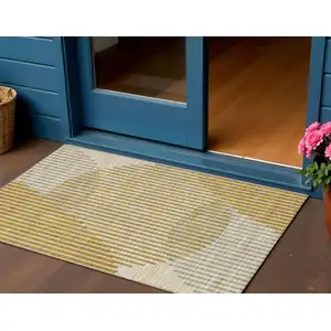 Photo of Gold And Beige Geometric Washable Indoor Outdoor Area Rug