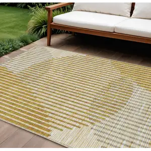 Photo of Gold And Beige Geometric Washable Indoor Outdoor Area Rug