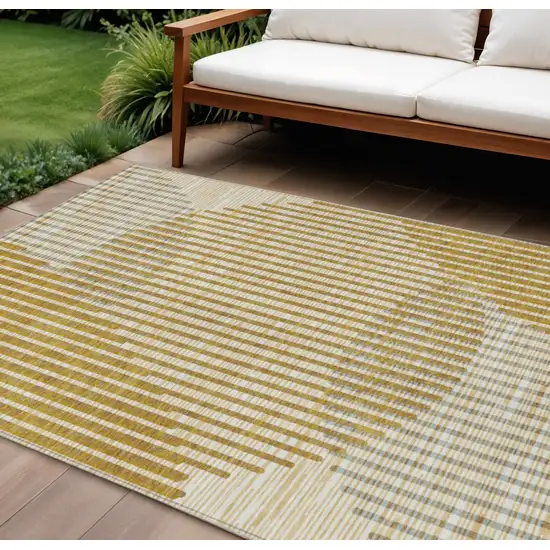 Gold And Beige Geometric Washable Indoor Outdoor Area Rug Photo 1