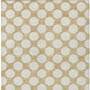 Photo of Gold And Beige Polka Dot Washable Indoor Outdoor Area Rug