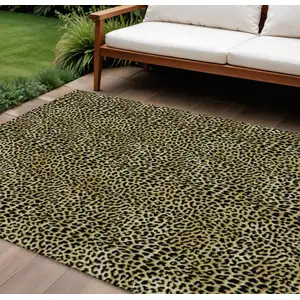 Photo of Gold And Black Leopard Print Washable Indoor Outdoor Area Rug