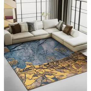 Photo of Gold And Blue Abstract Washable Area Rug With UV Protection