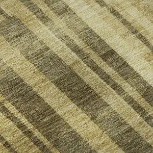 Photo of Gold And Brown Striped Washable Area Rug With UV Protection