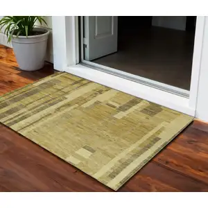 Photo of Gold And Dark Brown Striped Washable Indoor Outdoor Area Rug