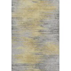 Photo of Gold And Gray Abstract Washable Area Rug With UV Protection