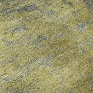 Photo of Gold And Gray Abstract Washable Area Rug With UV Protection
